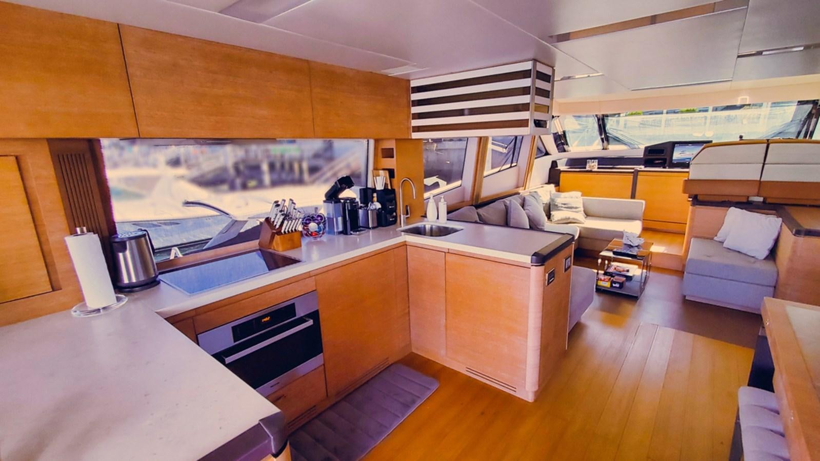 a kitchen with a large island aboard MANILA Yacht for Sale