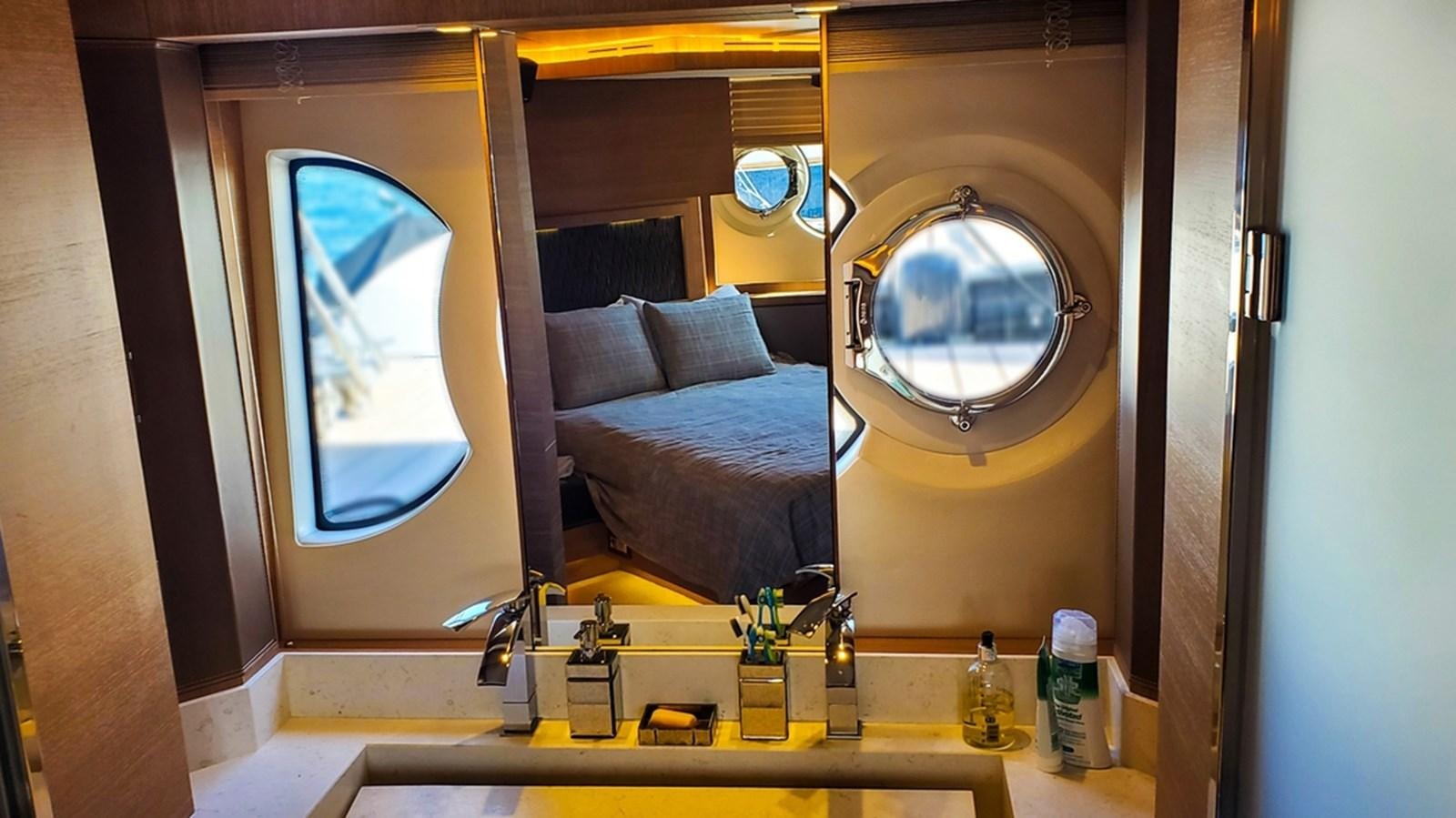 a bathroom with a large mirror aboard MANILA Yacht for Sale