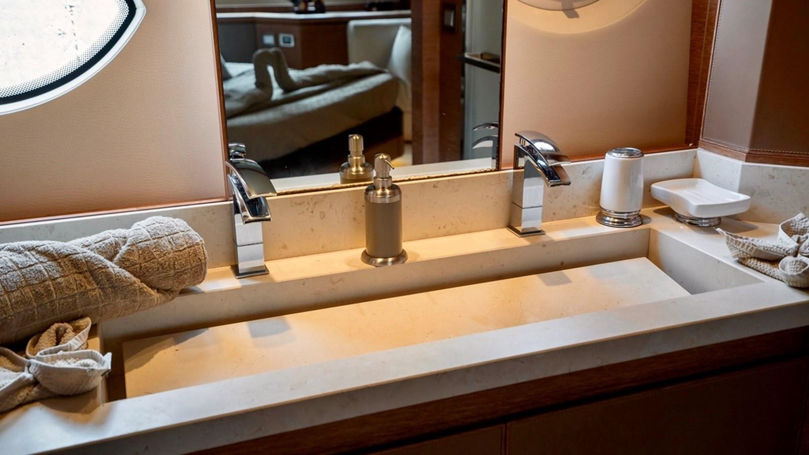 a bathroom sink with a towel aboard MANILA Yacht for Sale