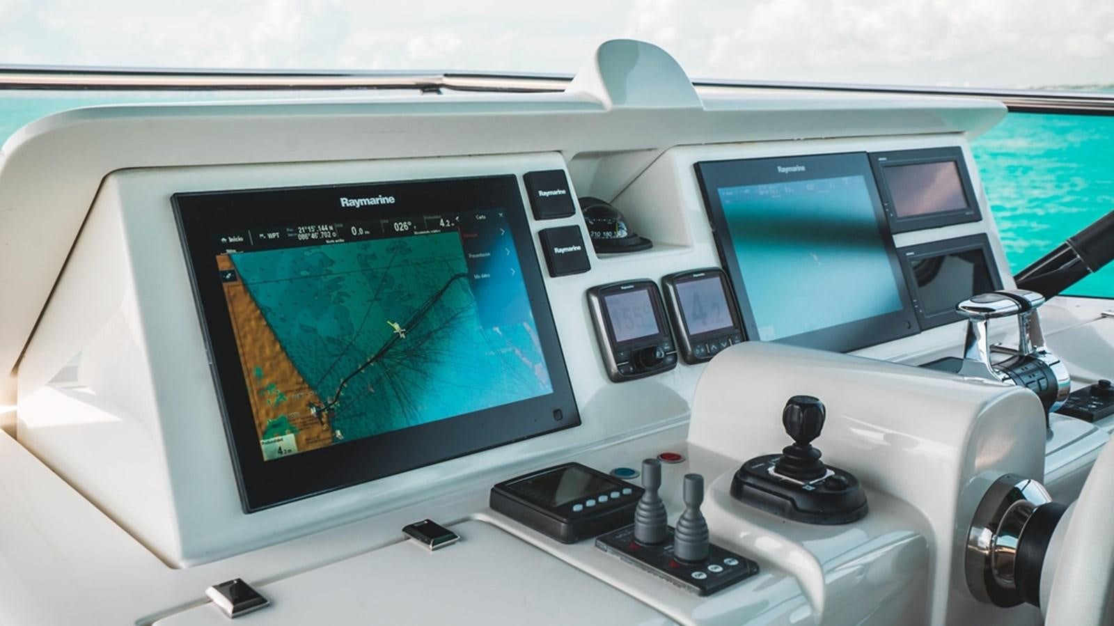 a computer with a screen and a monitor aboard MANILA Yacht for Sale