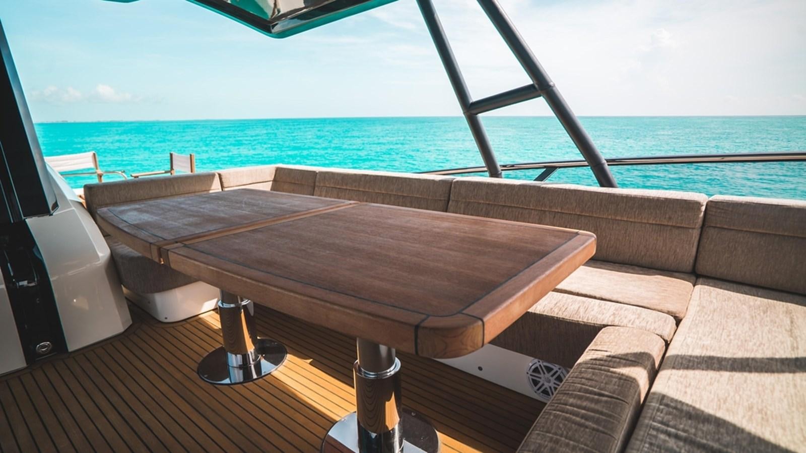 a room with a bed and a table on it aboard MANILA Yacht for Sale