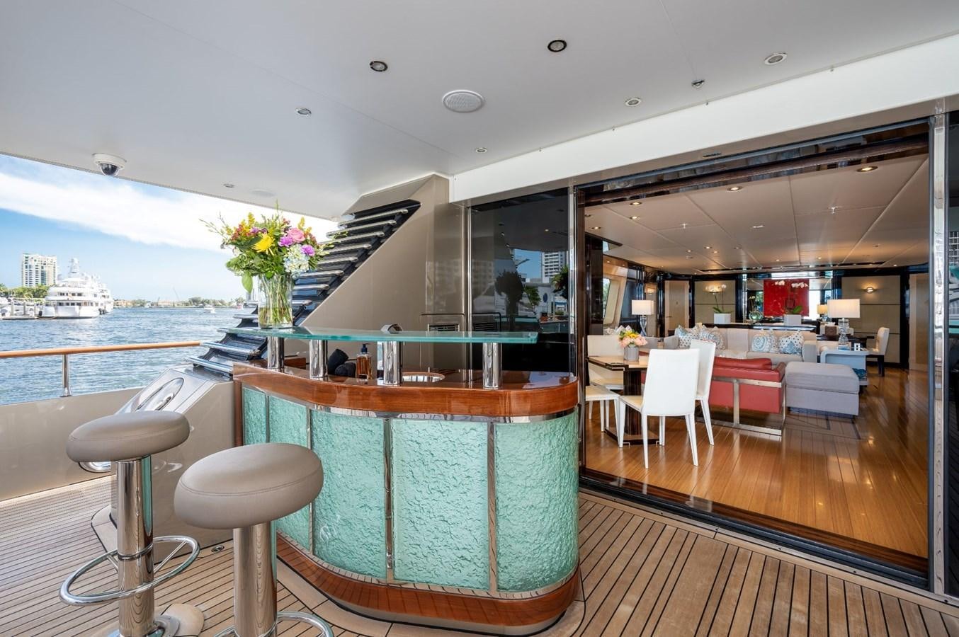 a room with a table and chairs aboard VESPER Yacht for Sale