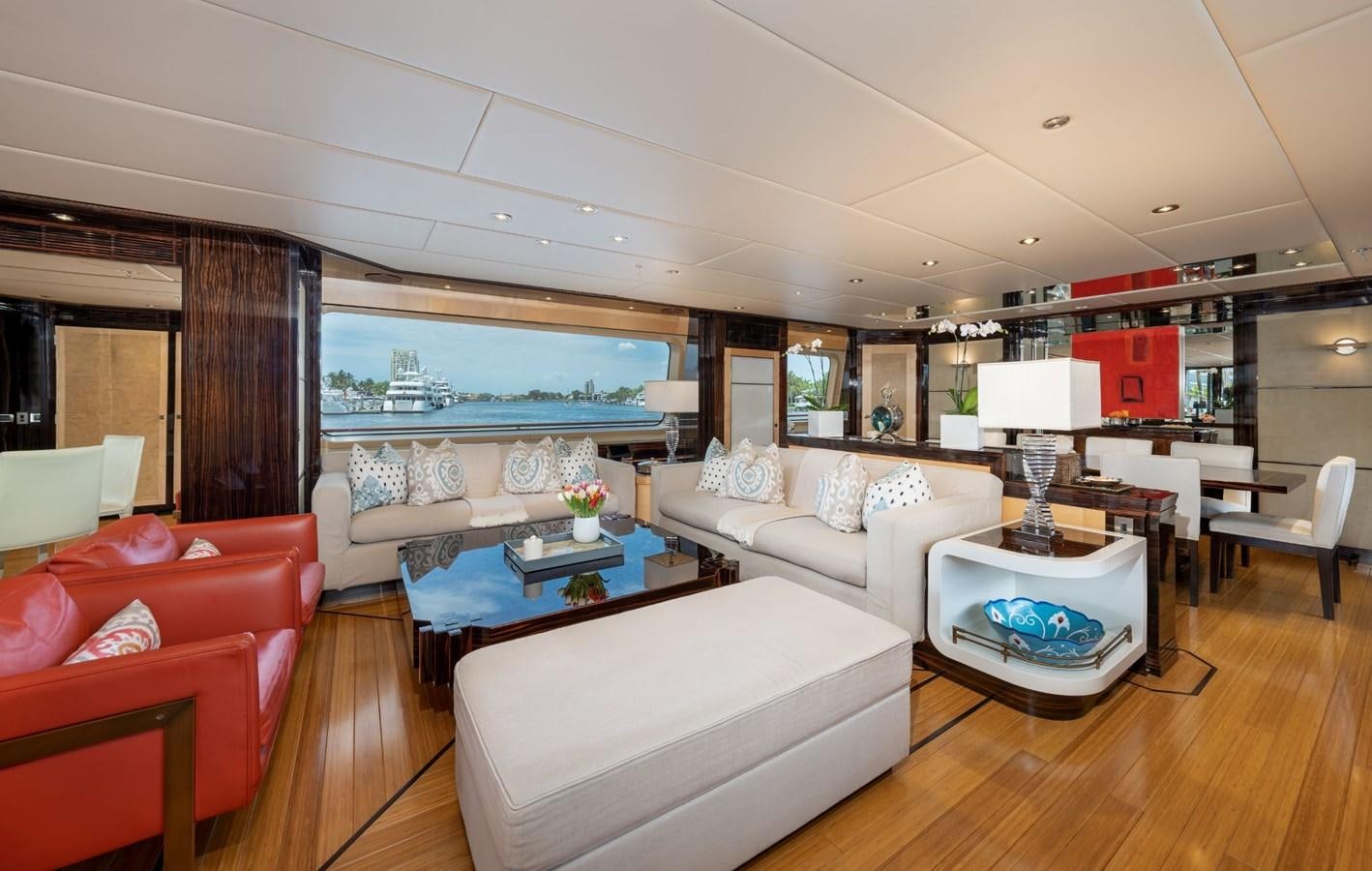 a living room with a large window aboard VESPER Yacht for Sale