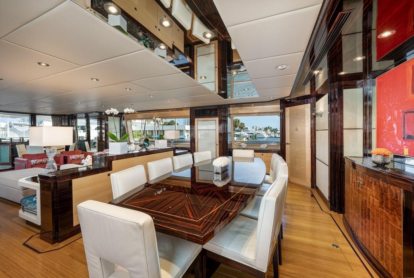 a room with a table chairs and a large window aboard VESPER Yacht for Sale
