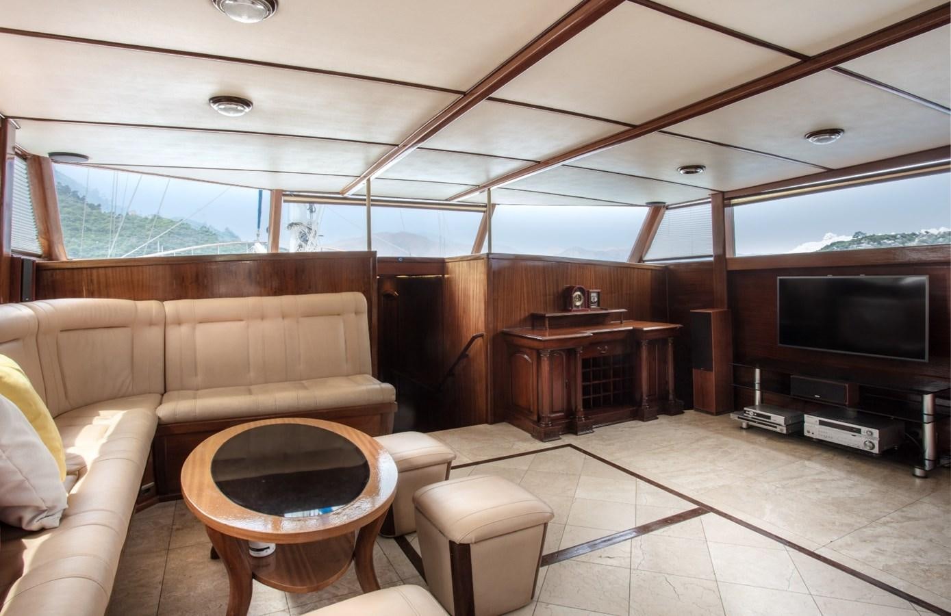 a living room with a large tv aboard ROYAL MARIS Yacht for Sale