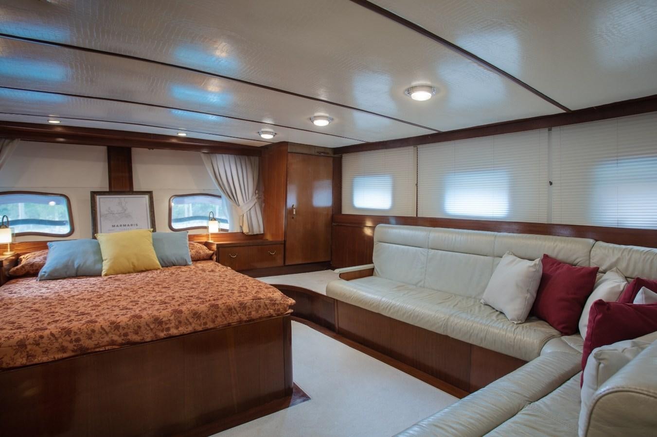 a room with a bed and a couch aboard ROYAL MARIS Yacht for Sale