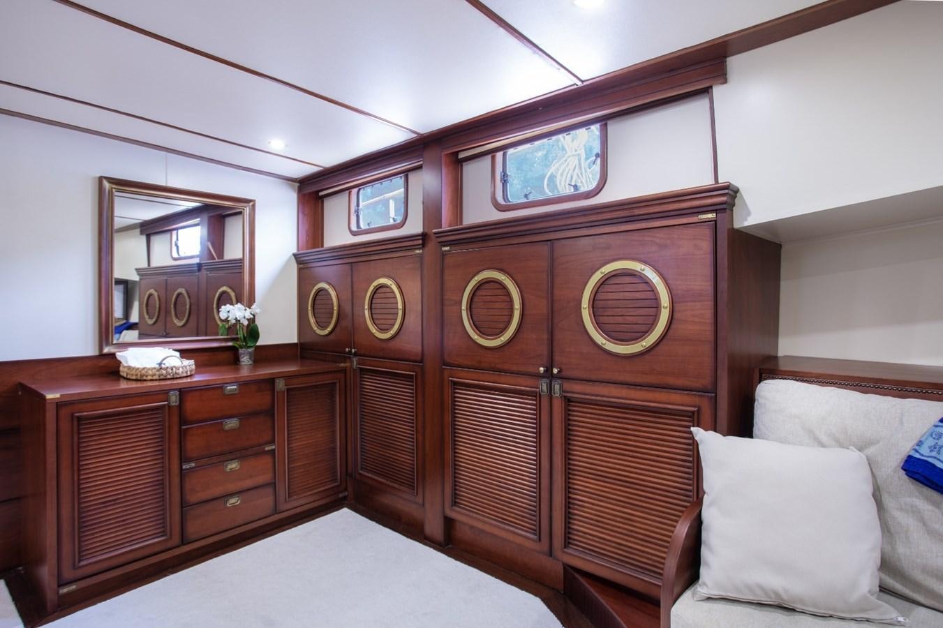 a room with a bed and a dresser aboard ROYAL MARIS Yacht for Sale