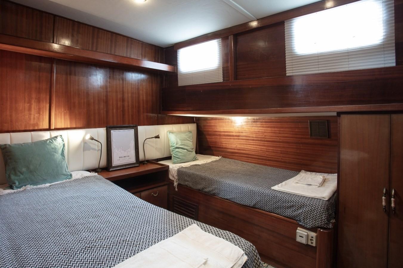 a room with wooden cabinets aboard ROYAL MARIS Yacht for Sale