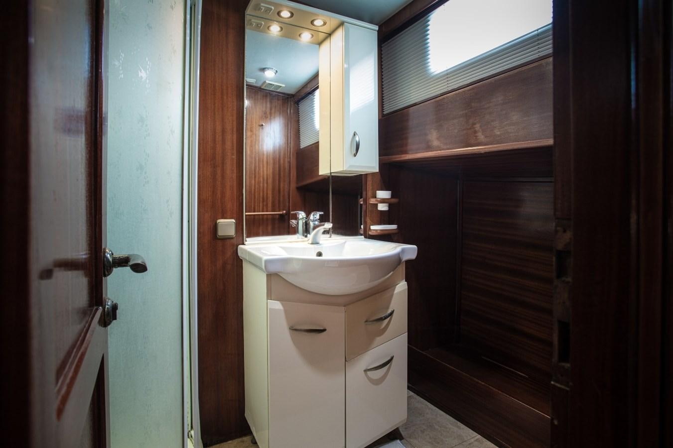 a bathroom with a sink and a mirror aboard ROYAL MARIS Yacht for Sale