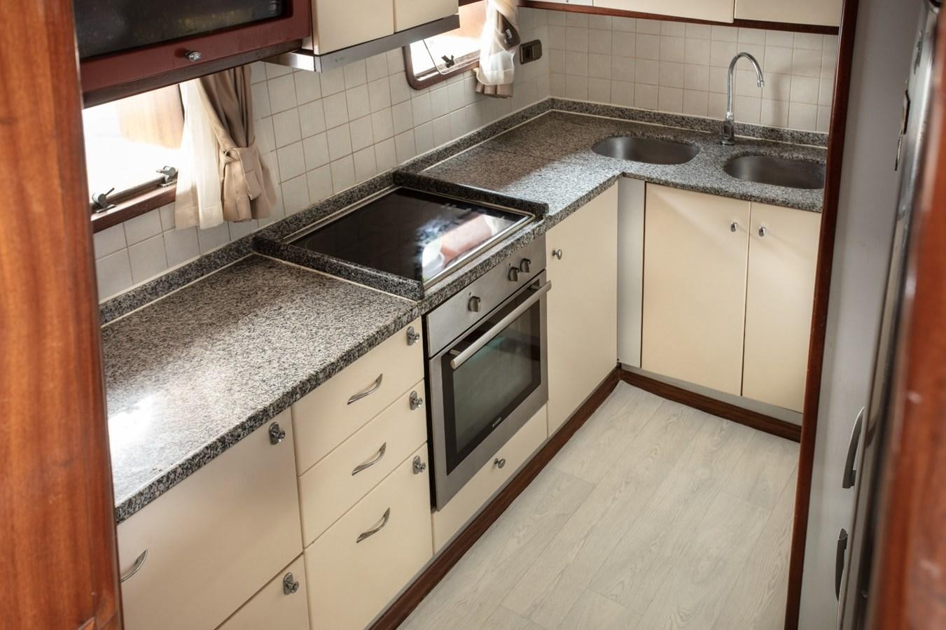 a kitchen with a stove and a sink aboard ROYAL MARIS Yacht for Sale