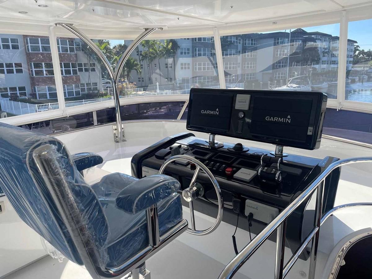 inside of a car aboard JOHNSON 80' SKYLOUNGE W/HYDRAULIC PLATFORM Yacht for Sale