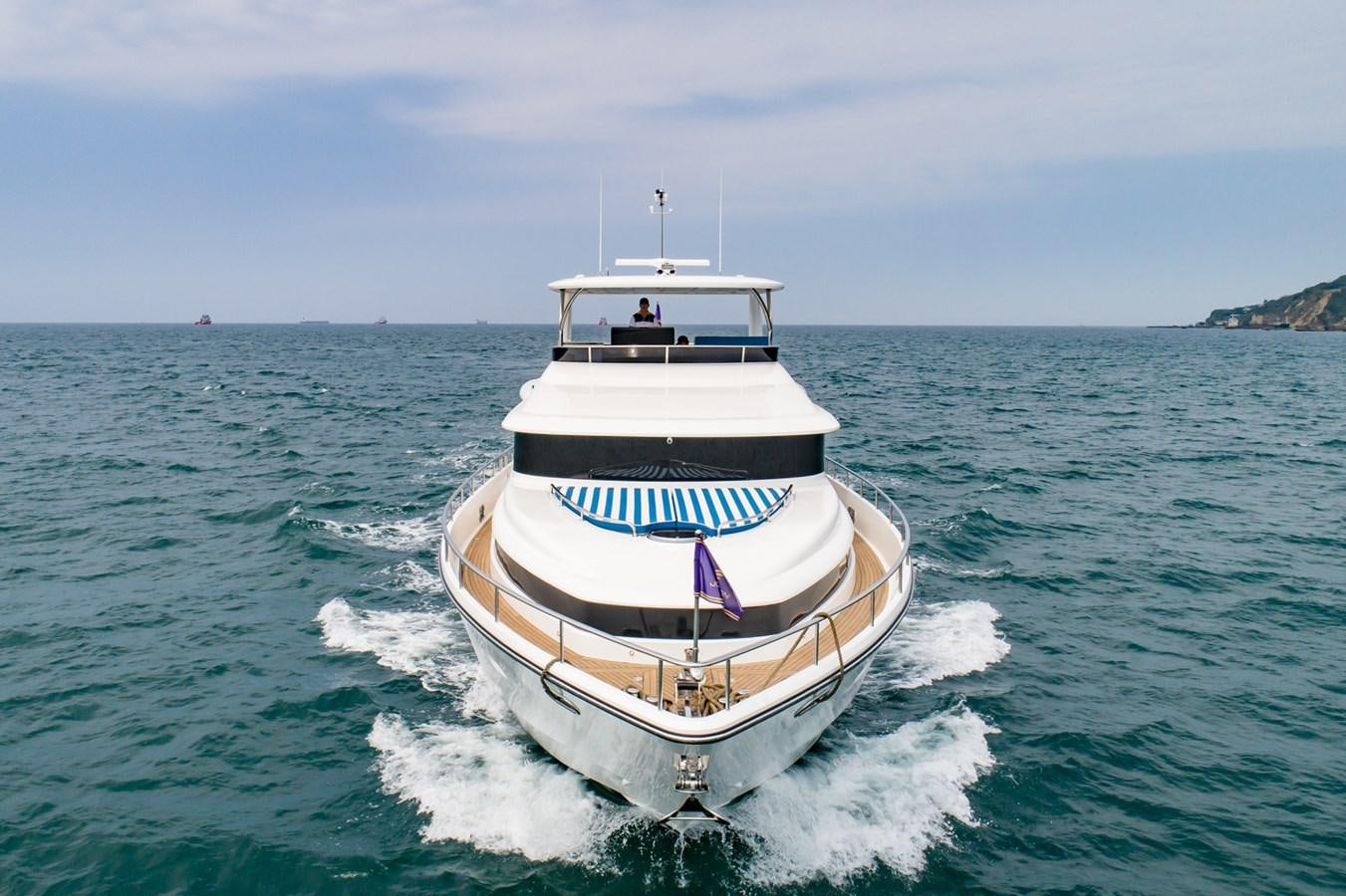 a boat on the water aboard JOHNSON 80' SKYLOUNGE W/HYDRAULIC PLATFORM Yacht for Sale