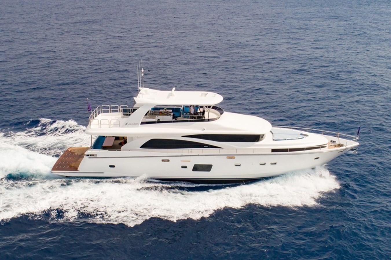 a boat on the water aboard JOHNSON 80' SKYLOUNGE W/HYDRAULIC PLATFORM Yacht for Sale
