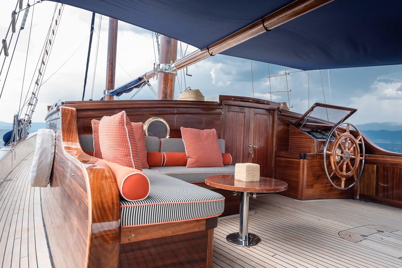 a boat with a bed and a table aboard CAPTAIN COOK Yacht for Sale