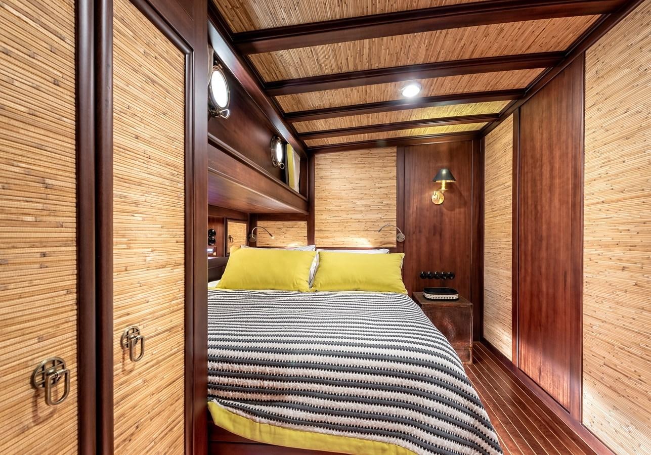 a bed in a room aboard CAPTAIN COOK Yacht for Sale