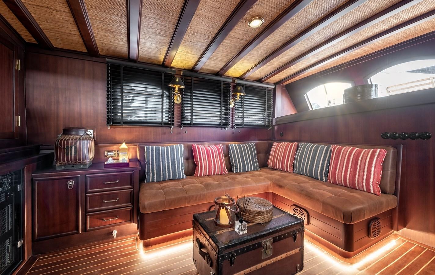 a living room with a couch and a coffee table aboard CAPTAIN COOK Yacht for Sale