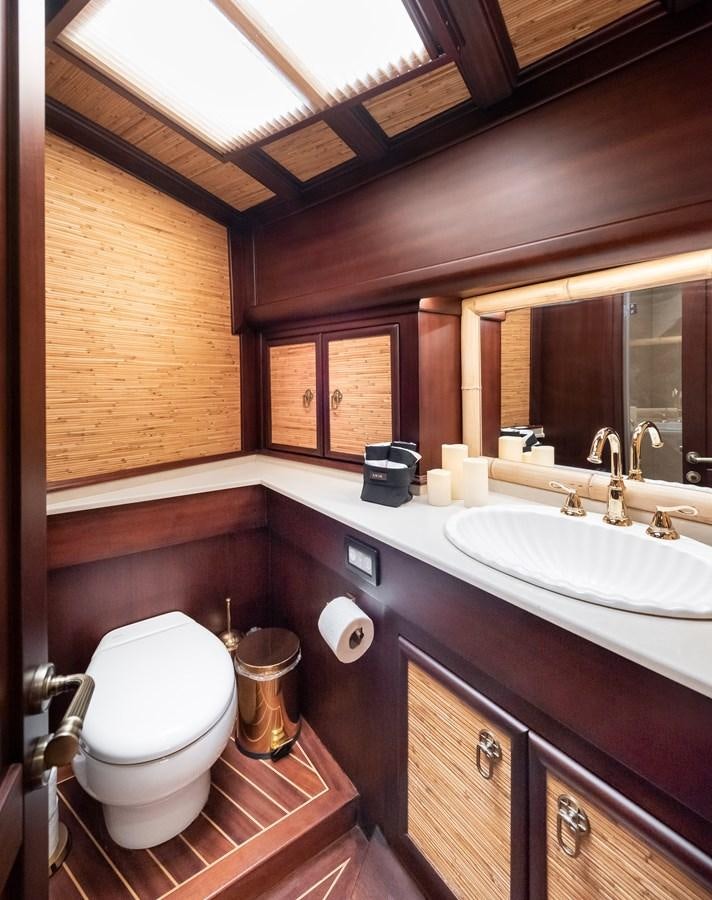 a bathroom with a toilet and sink aboard CAPTAIN COOK Yacht for Sale