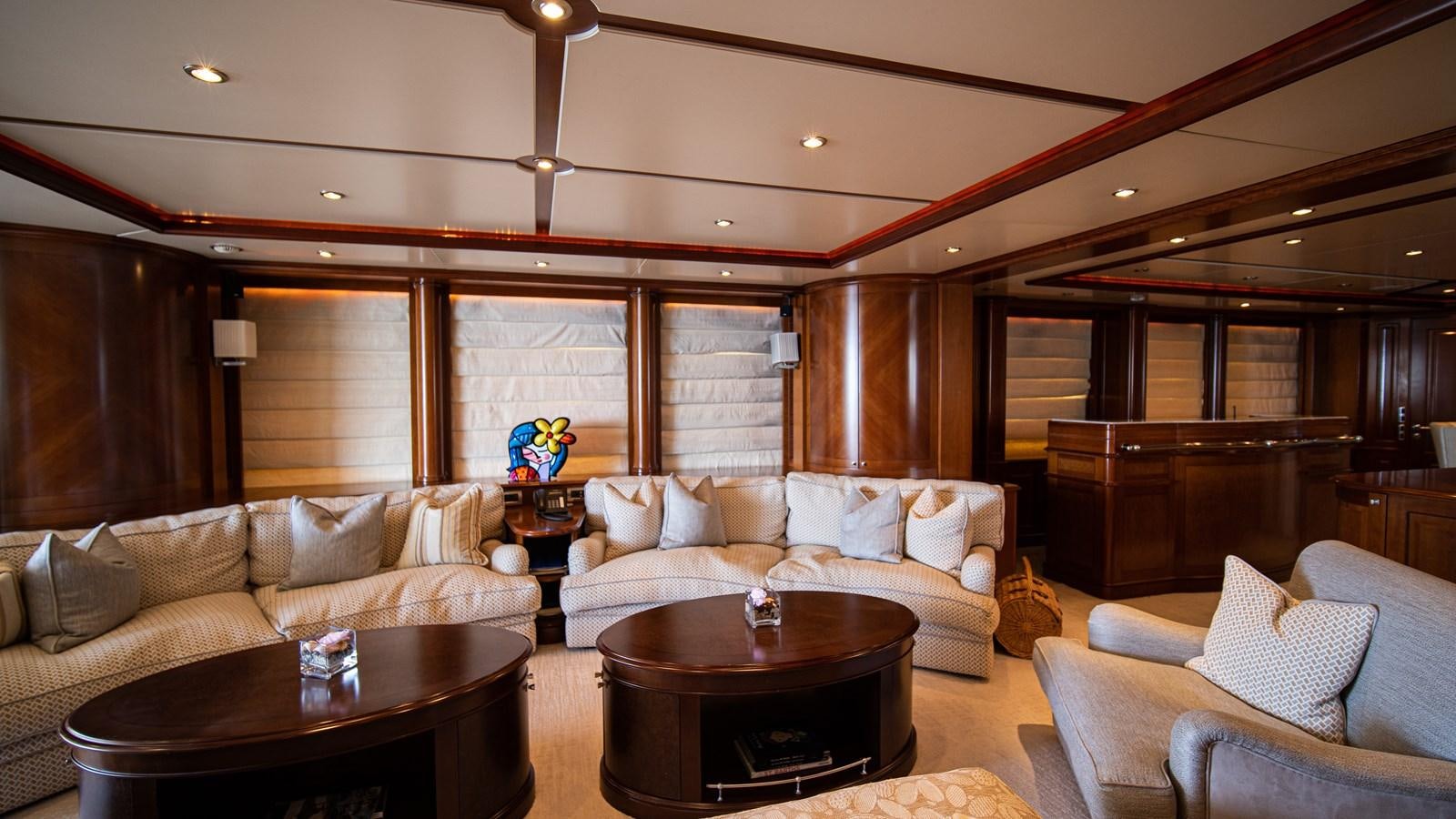 a living room with a couch and a coffee table aboard ORINOKIA Yacht for Sale