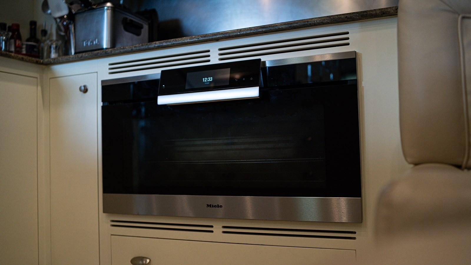 a microwave oven on a counter aboard ORINOKIA Yacht for Sale