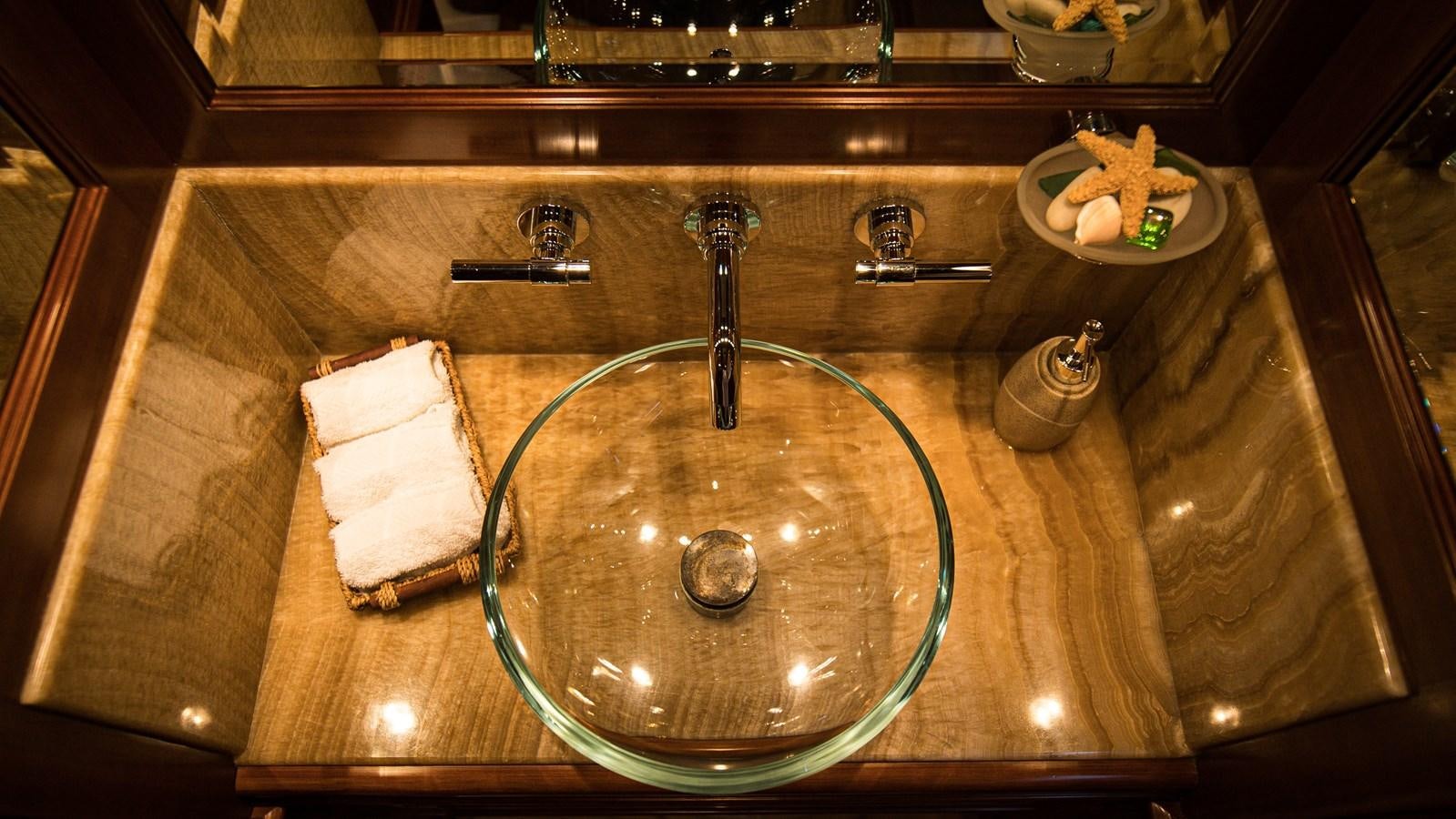 a sink with a bowl of water and a bowl of food aboard ORINOKIA Yacht for Sale