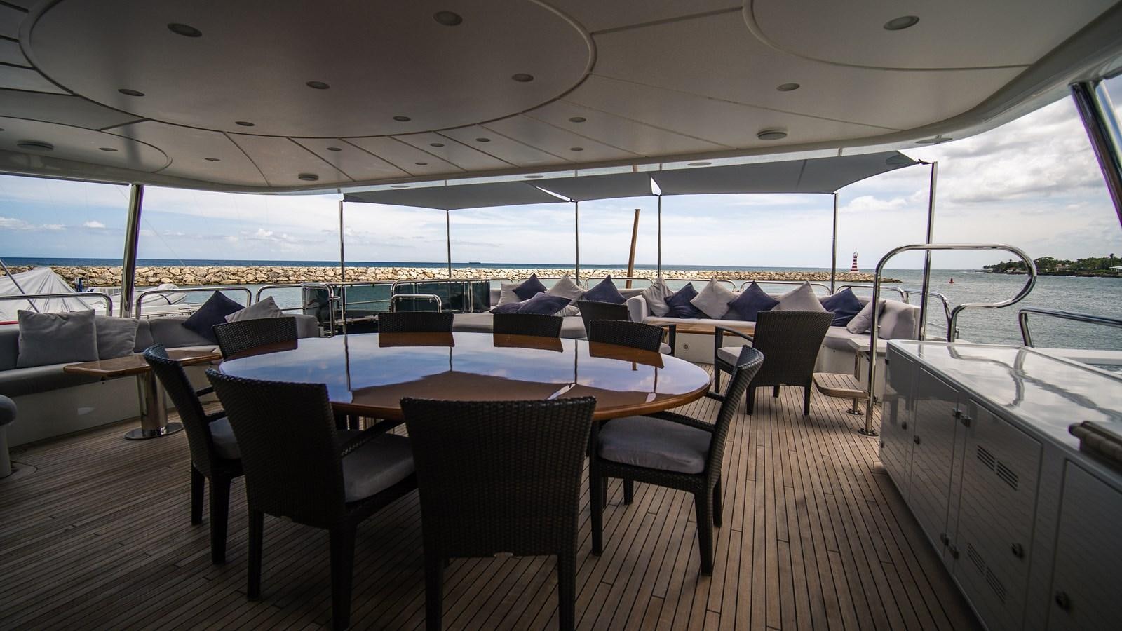 a table and chairs on a boat aboard ORINOKIA Yacht for Sale