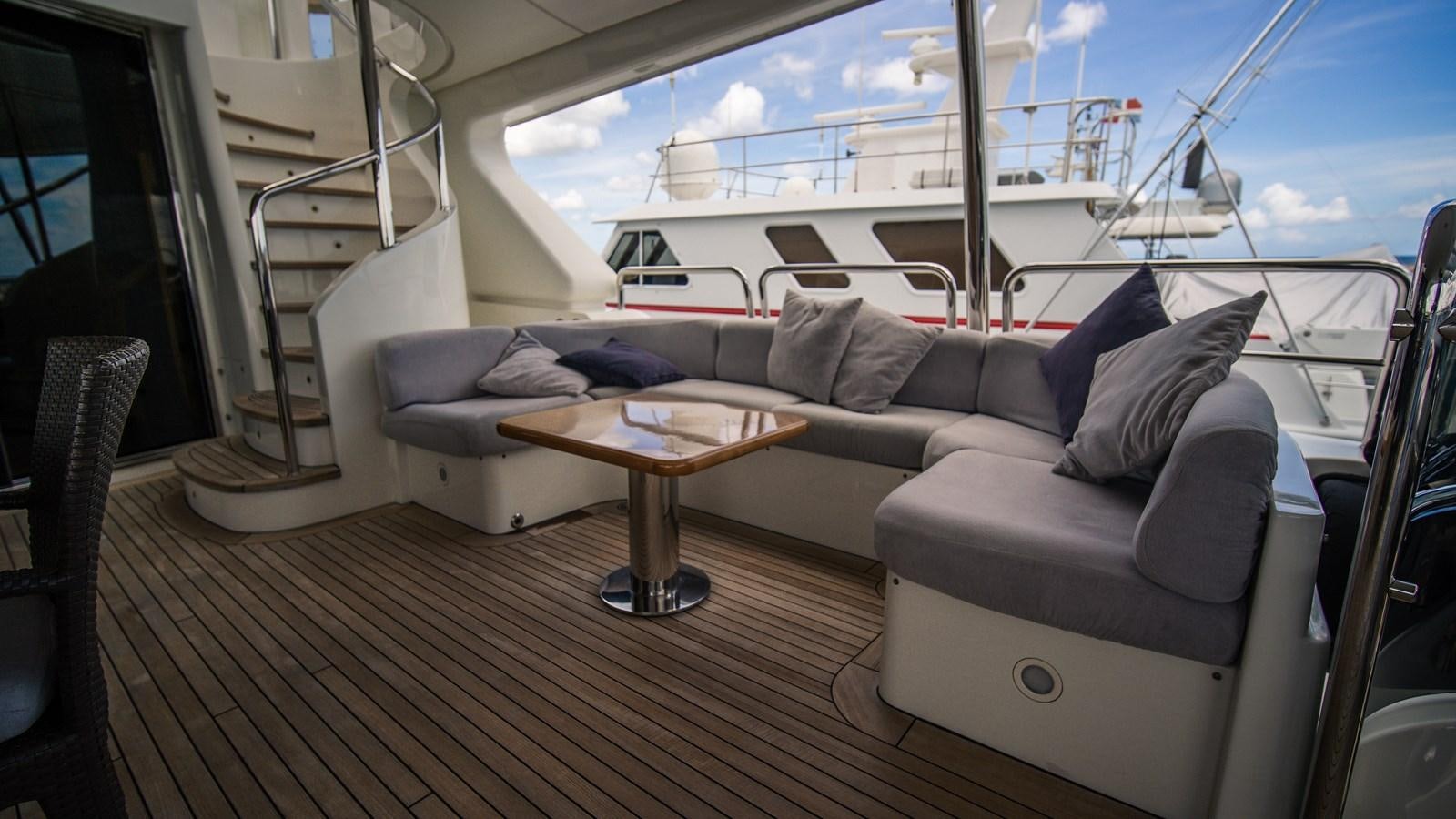 a couch and a table on a boat aboard ORINOKIA Yacht for Sale