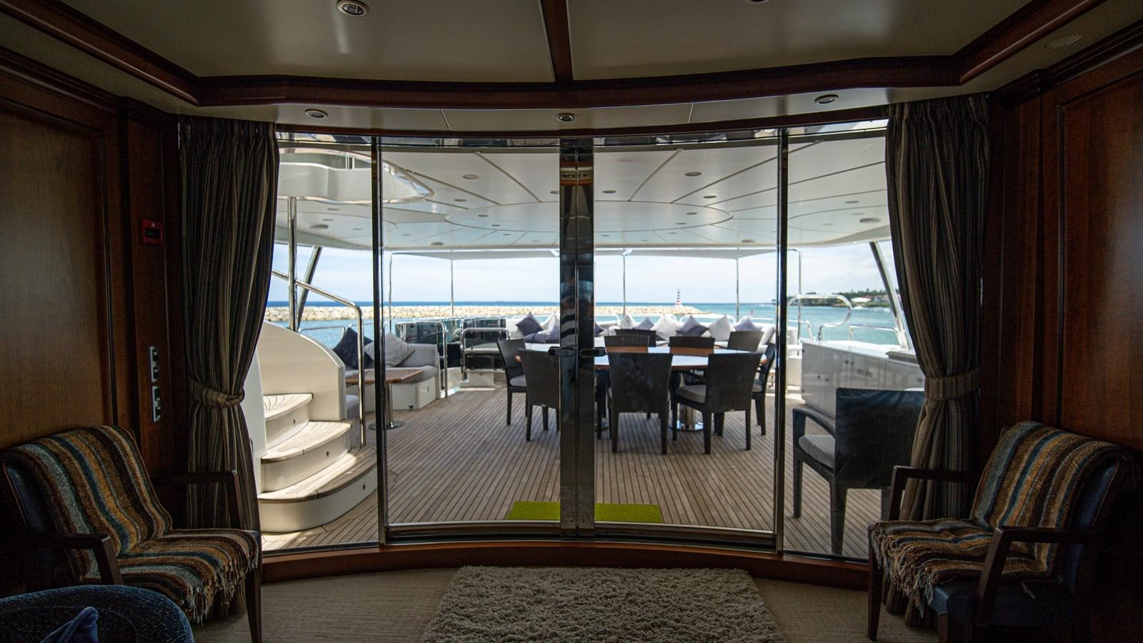 a room with a table and chairs aboard ORINOKIA Yacht for Sale