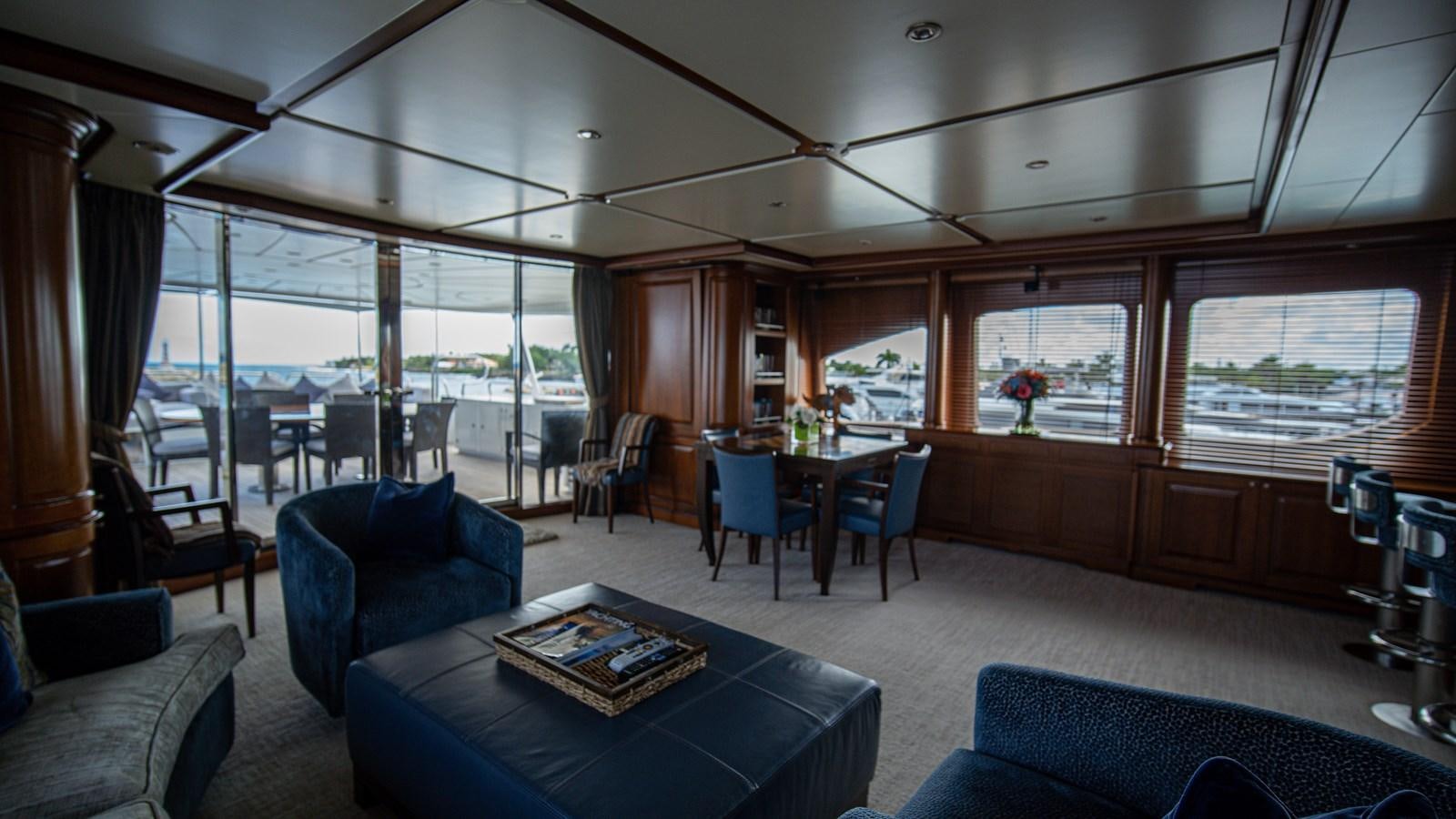 a room with a table and chairs aboard ORINOKIA Yacht for Sale