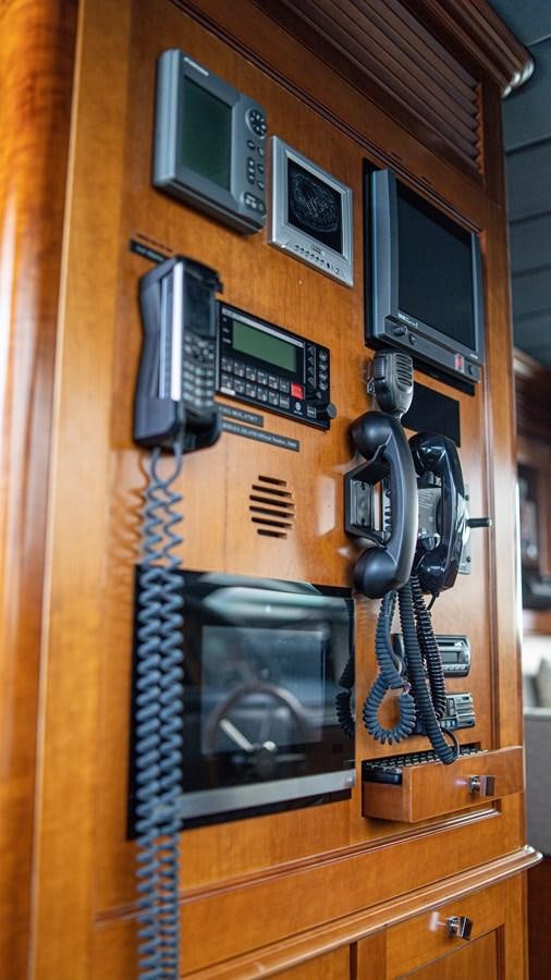 a group of telephones on a wall aboard ORINOKIA Yacht for Sale