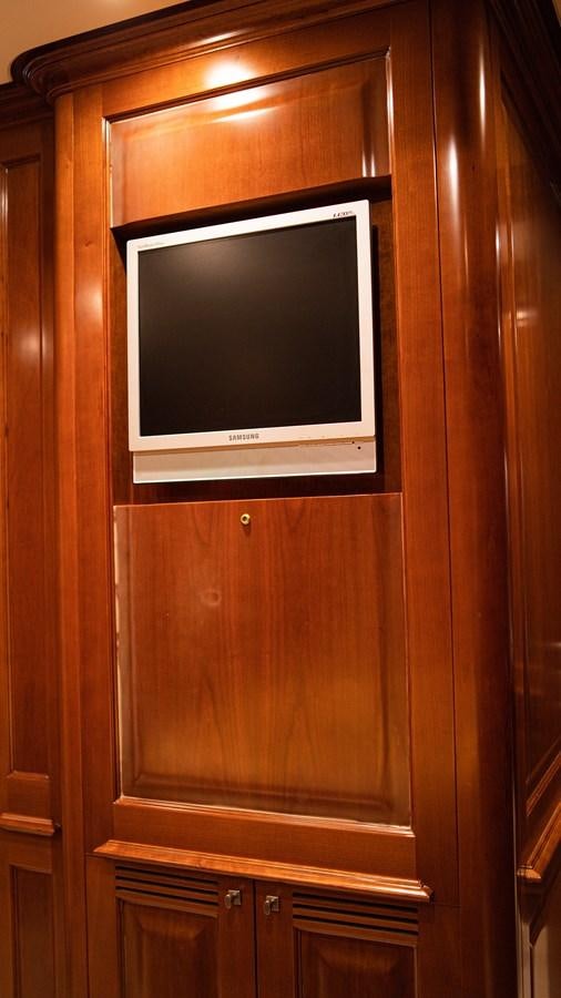 a tv on a cabinet aboard ORINOKIA Yacht for Sale