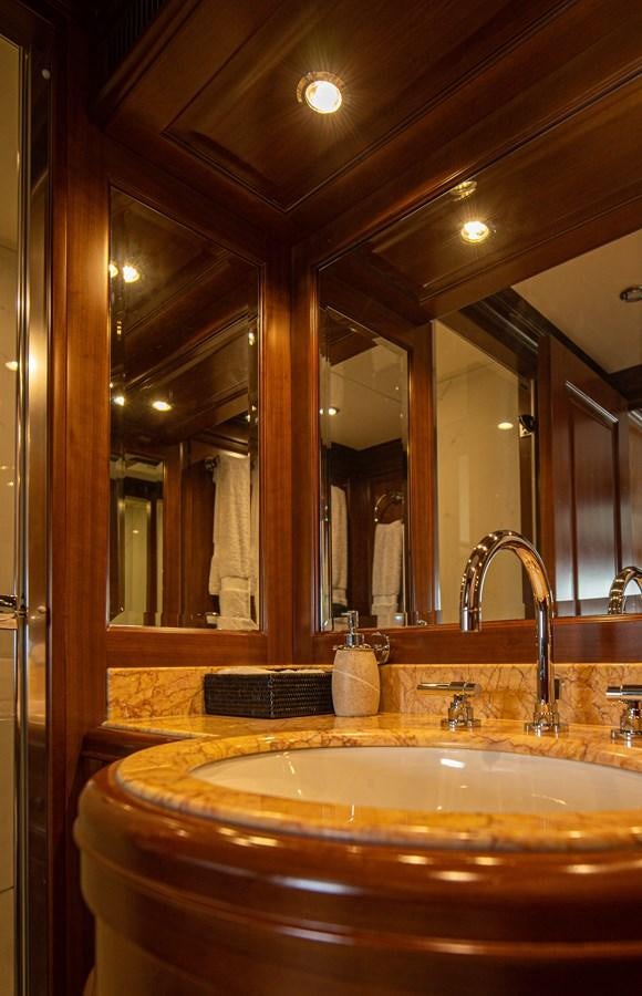 a bathroom with a large mirror aboard ORINOKIA Yacht for Sale