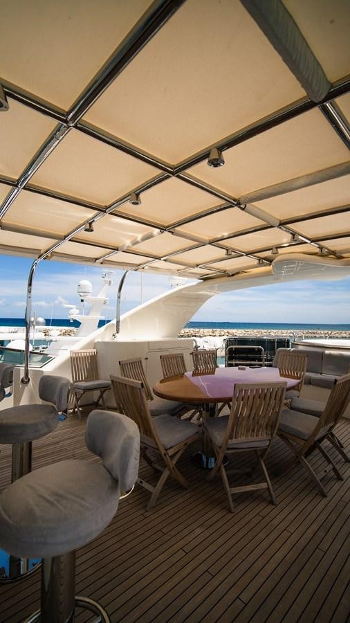 a boat with tables and chairs aboard ORINOKIA Yacht for Sale