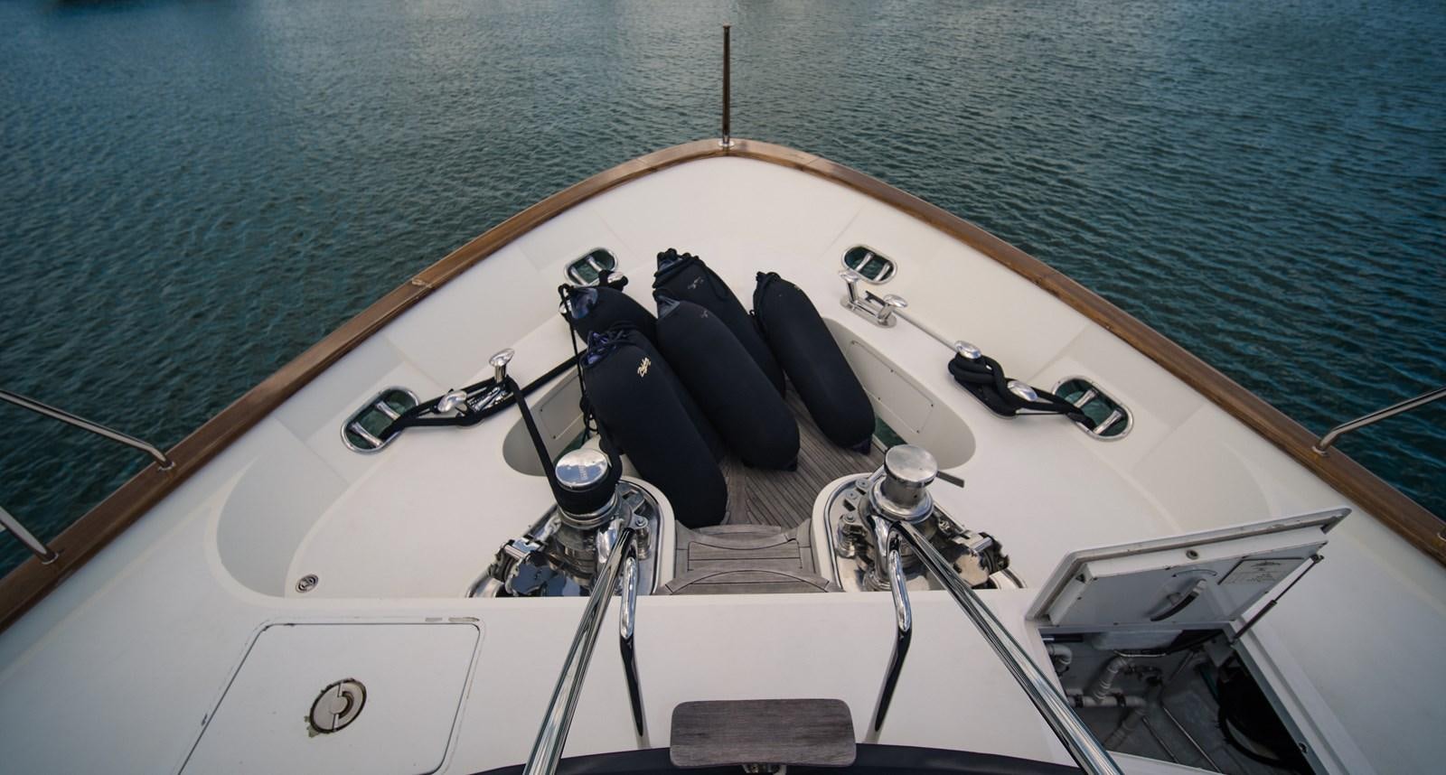 a boat with a steering wheel and a metal bar on the front aboard ORINOKIA Yacht for Sale