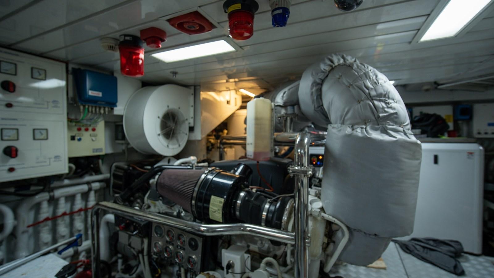 a person in a white coat in a room with machines aboard ORINOKIA Yacht for Sale