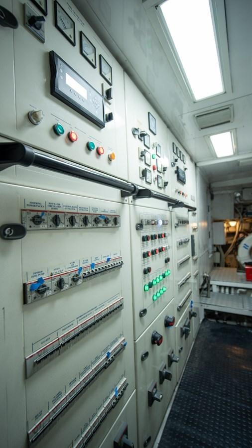 a wall with switches and switches aboard ORINOKIA Yacht for Sale