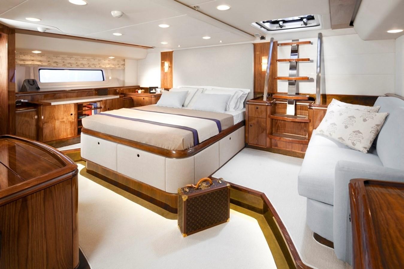 a room with a bed and a piano aboard SERAFIM Yacht for Sale
