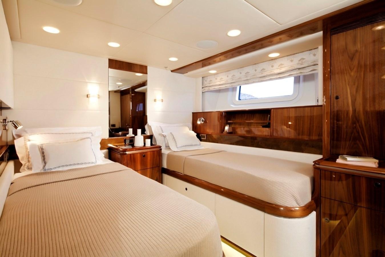 a room with a bed and a mirror aboard SERAFIM Yacht for Sale