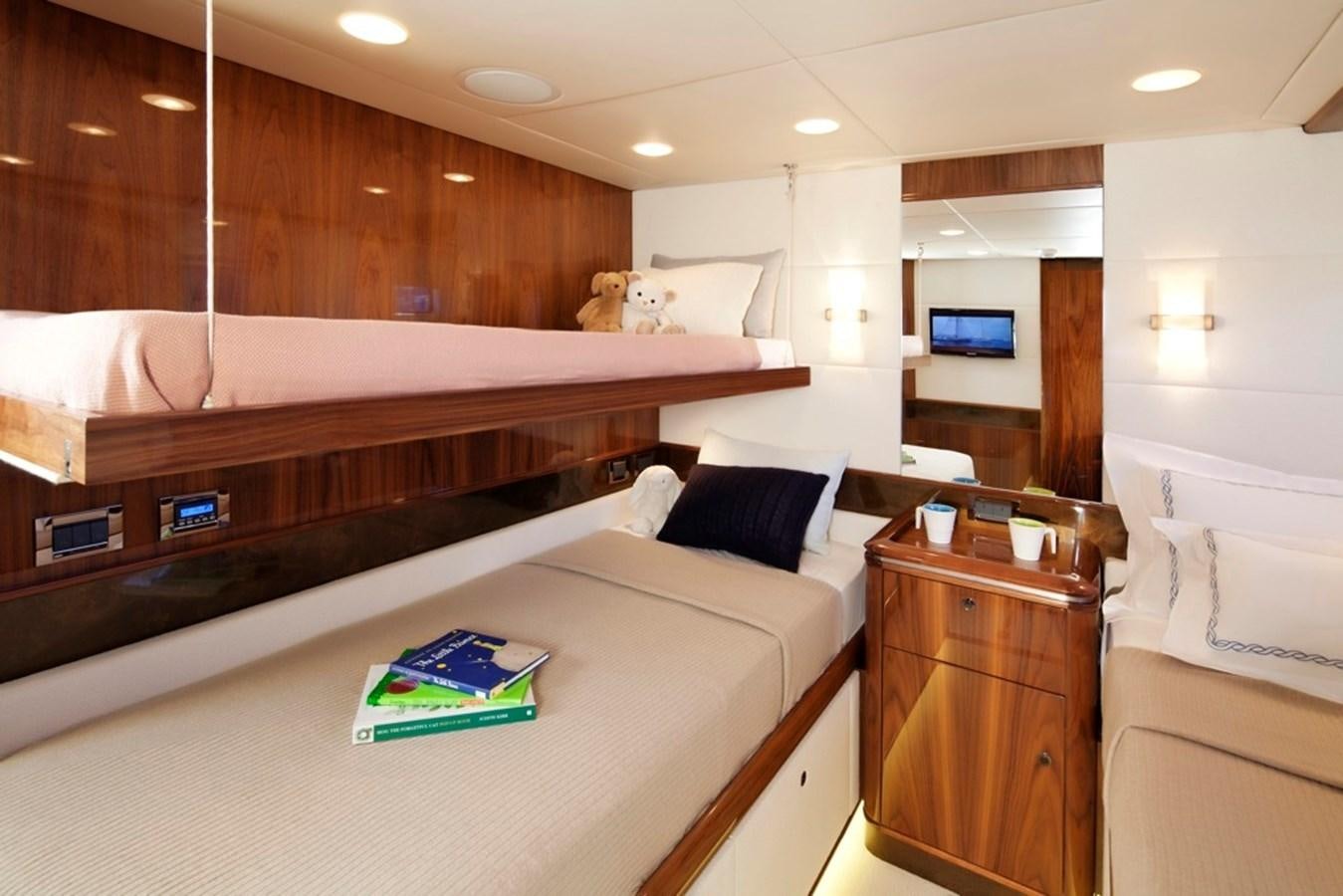 a room with a bed and a desk aboard SERAFIM Yacht for Sale