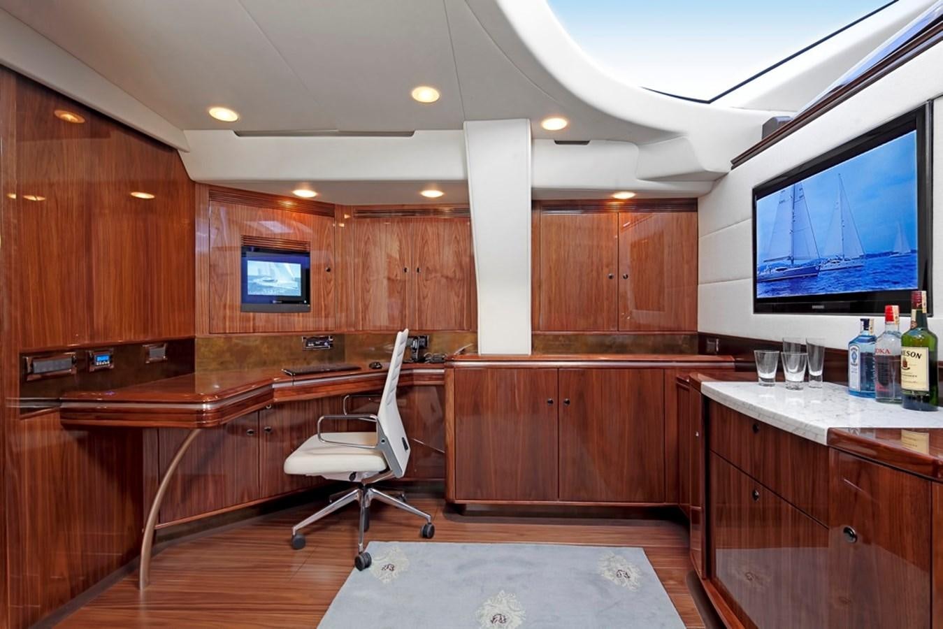 a room with a desk and a tv aboard SERAFIM Yacht for Sale