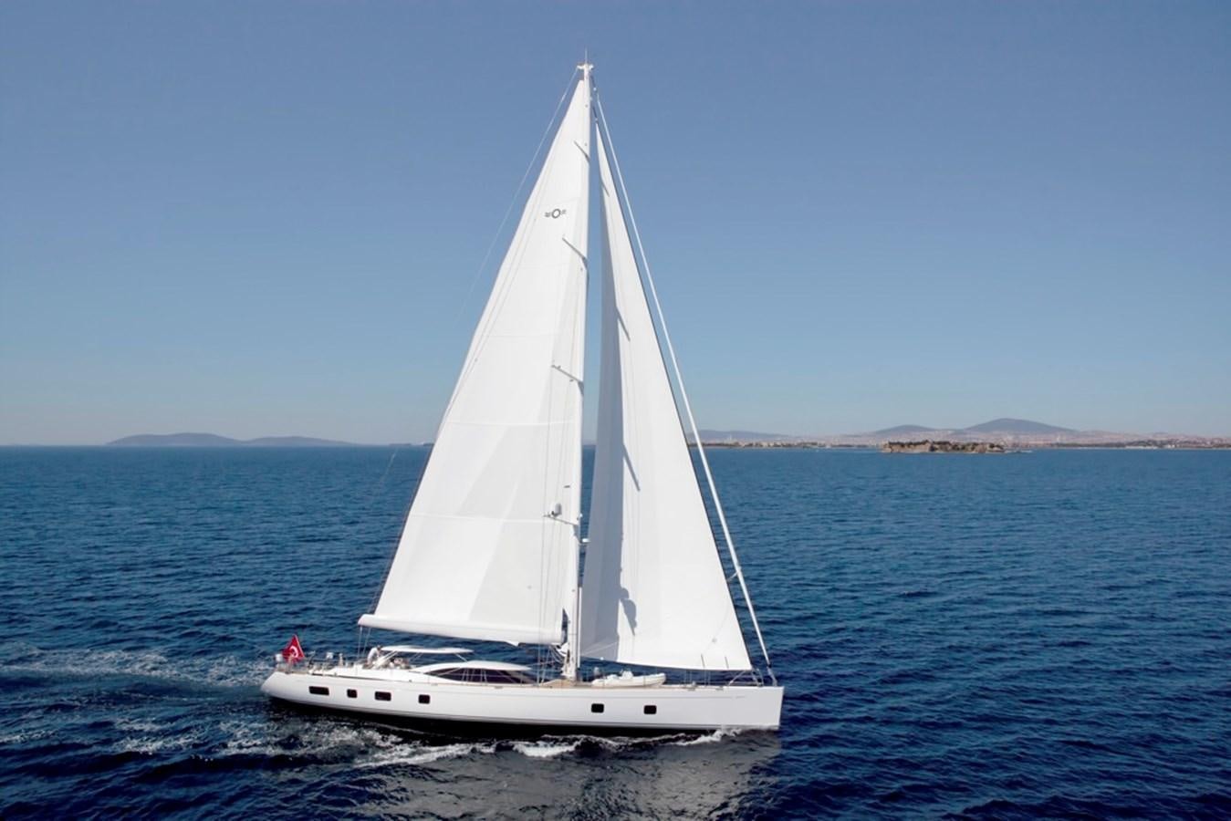 a white sailboat on the water aboard SERAFIM Yacht for Sale