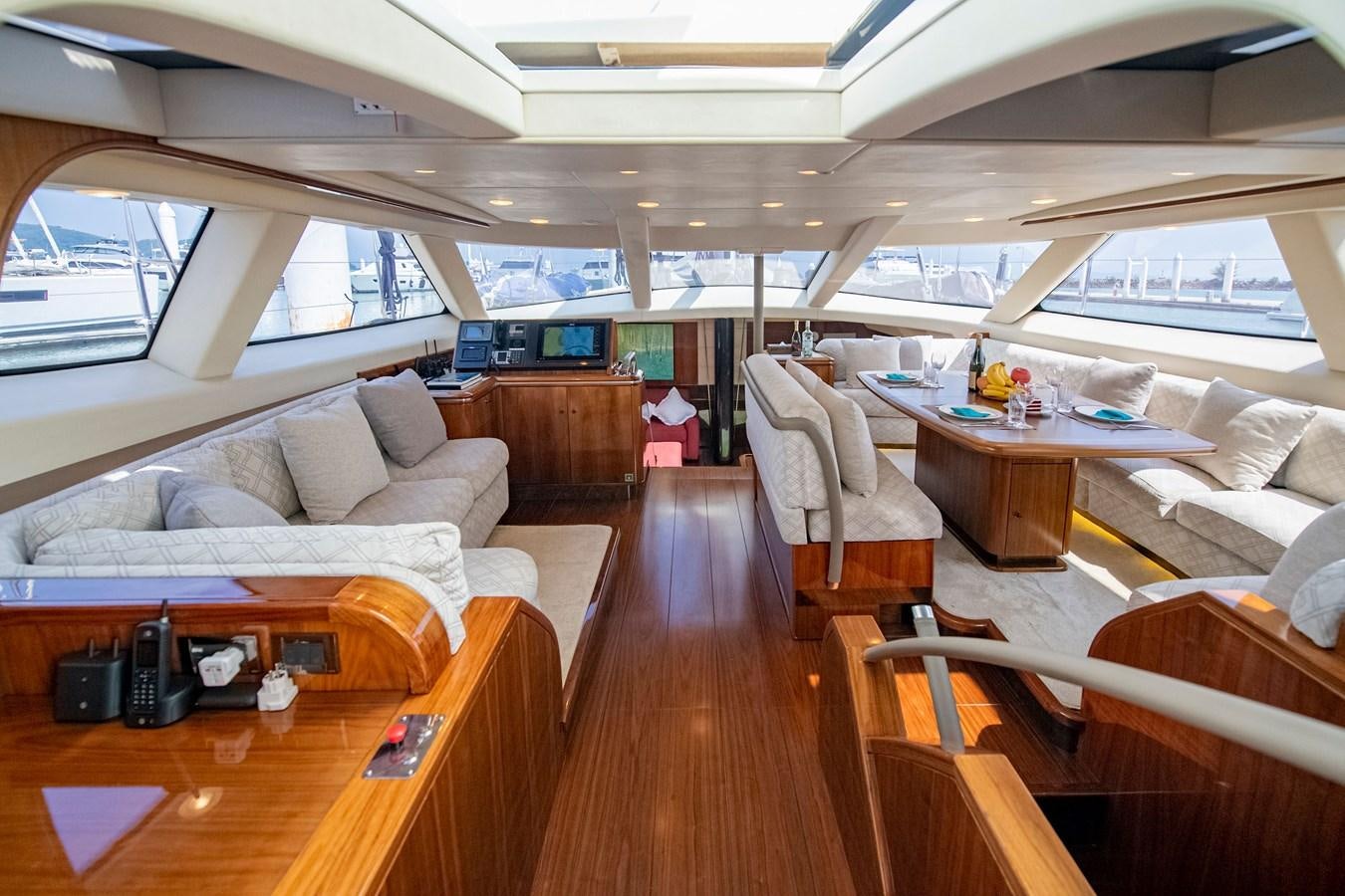 a living room with a couch and a table aboard SERAFIM Yacht for Sale