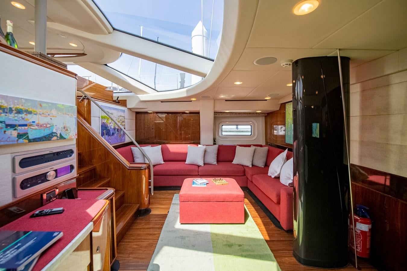 a room with a couch and a television aboard SERAFIM Yacht for Sale