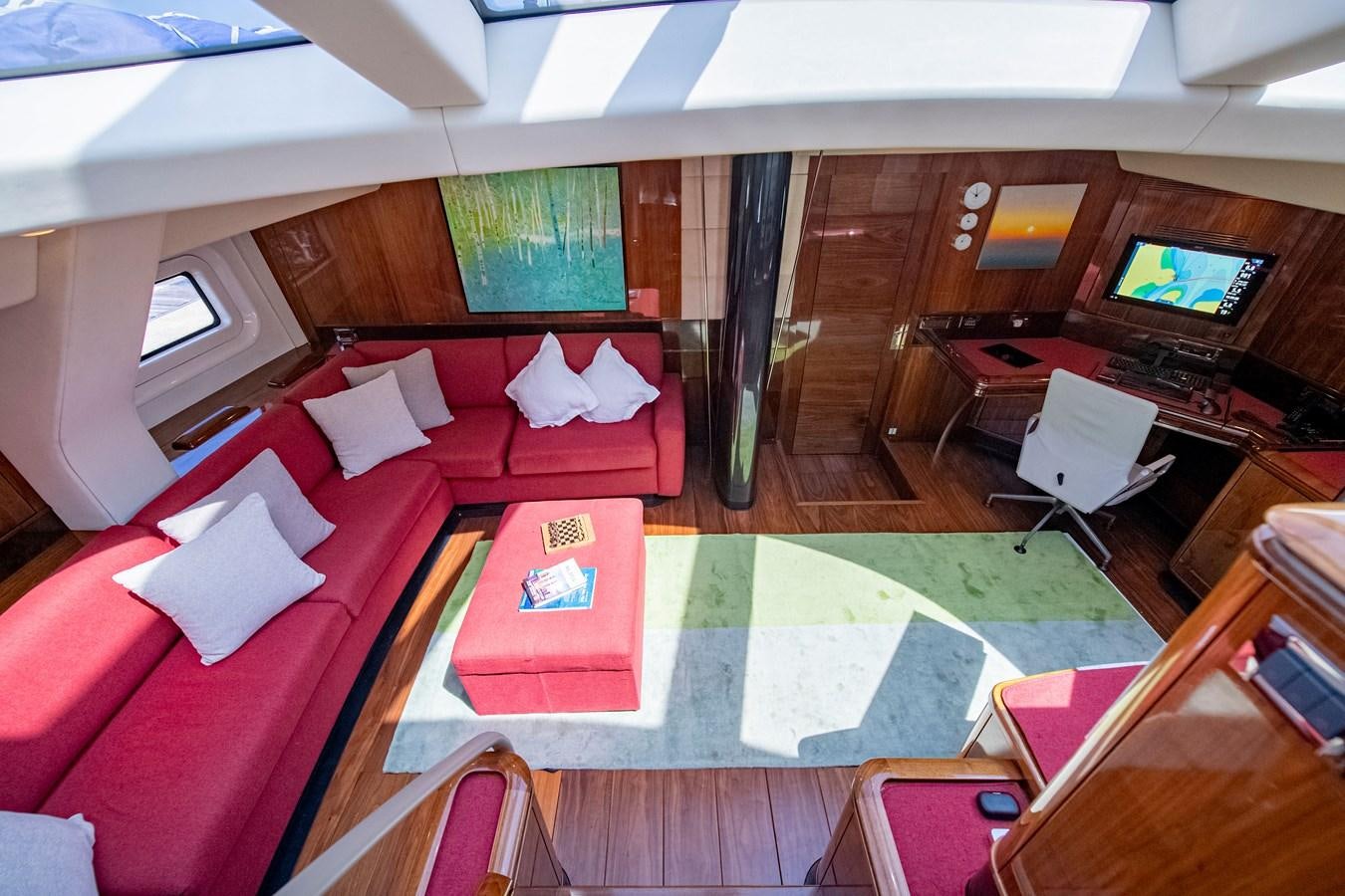 a room with a bed and a television aboard SERAFIM Yacht for Sale