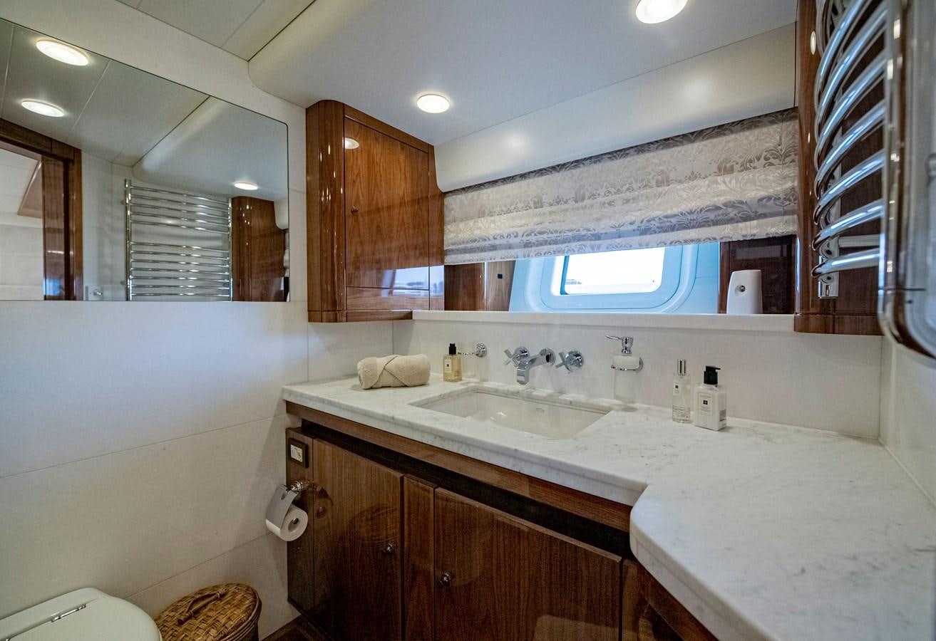 a bathroom with a sink and cabinets aboard SERAFIM Yacht for Sale