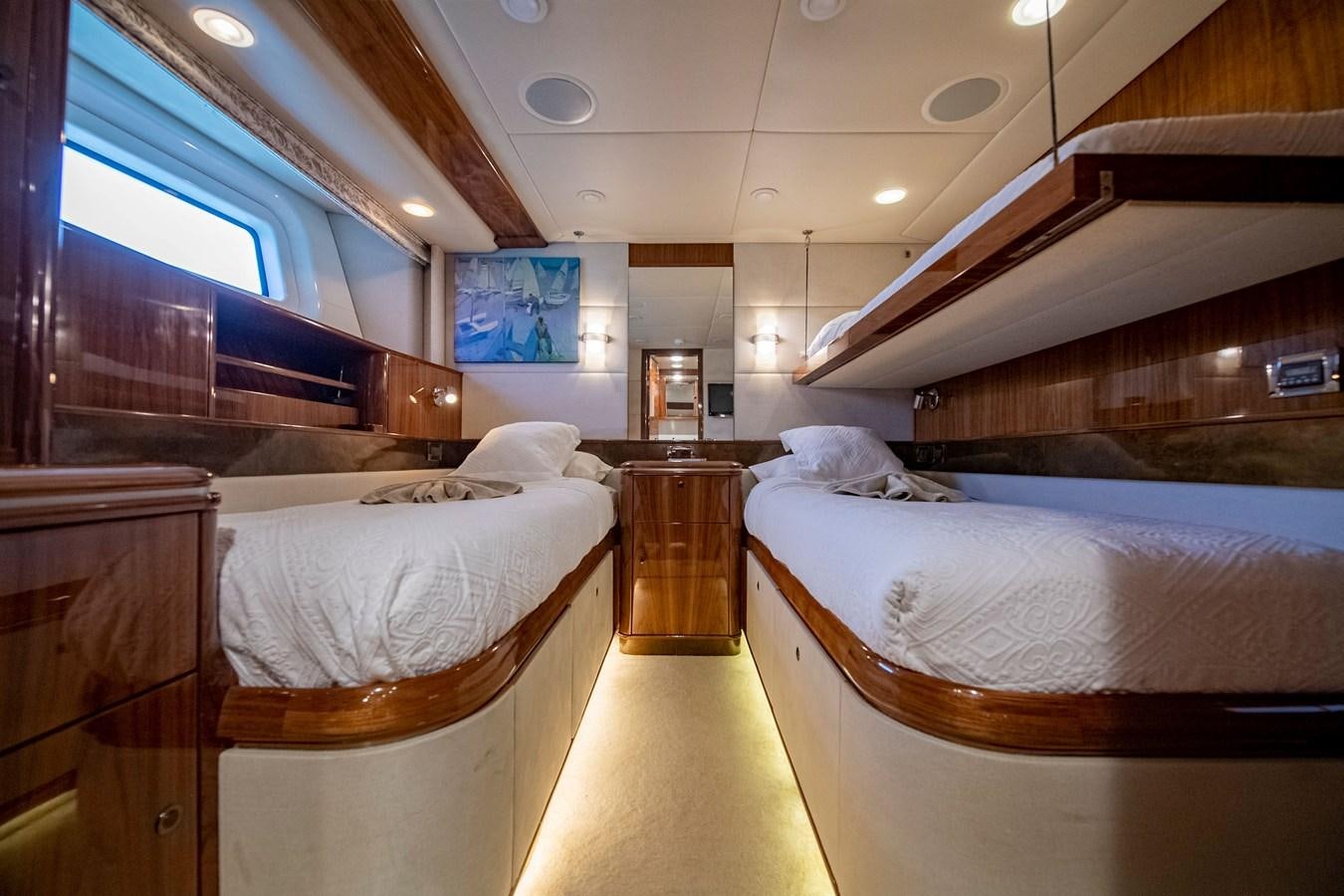 a room with beds and a window aboard SERAFIM Yacht for Sale