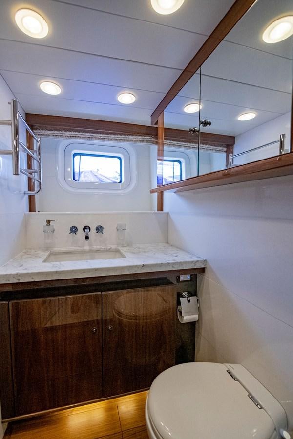 a bathroom with a sink and a toilet aboard SERAFIM Yacht for Sale