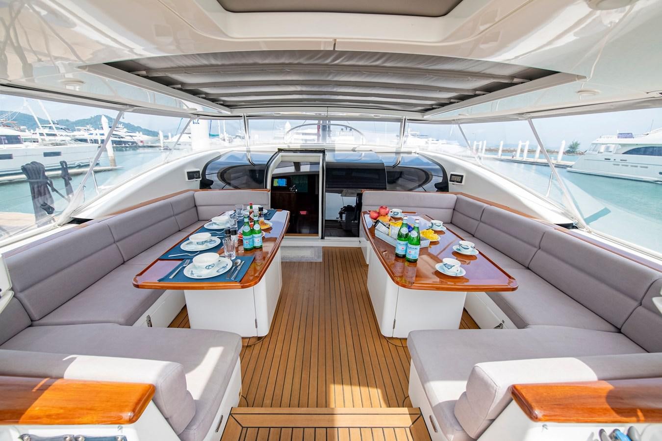 a boat with a table and chairs aboard SERAFIM Yacht for Sale