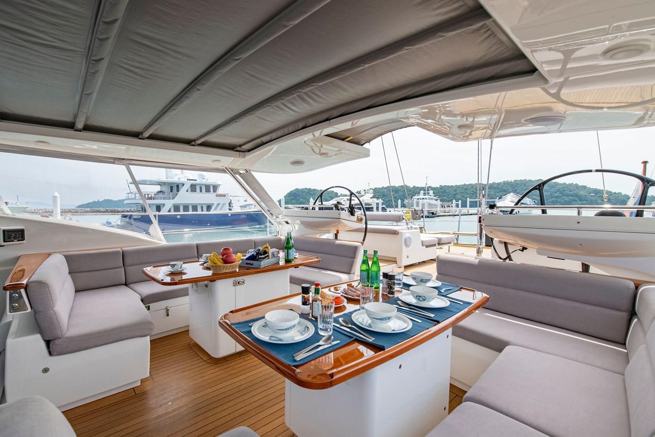 a boat with a table and chairs aboard SERAFIM Yacht for Sale
