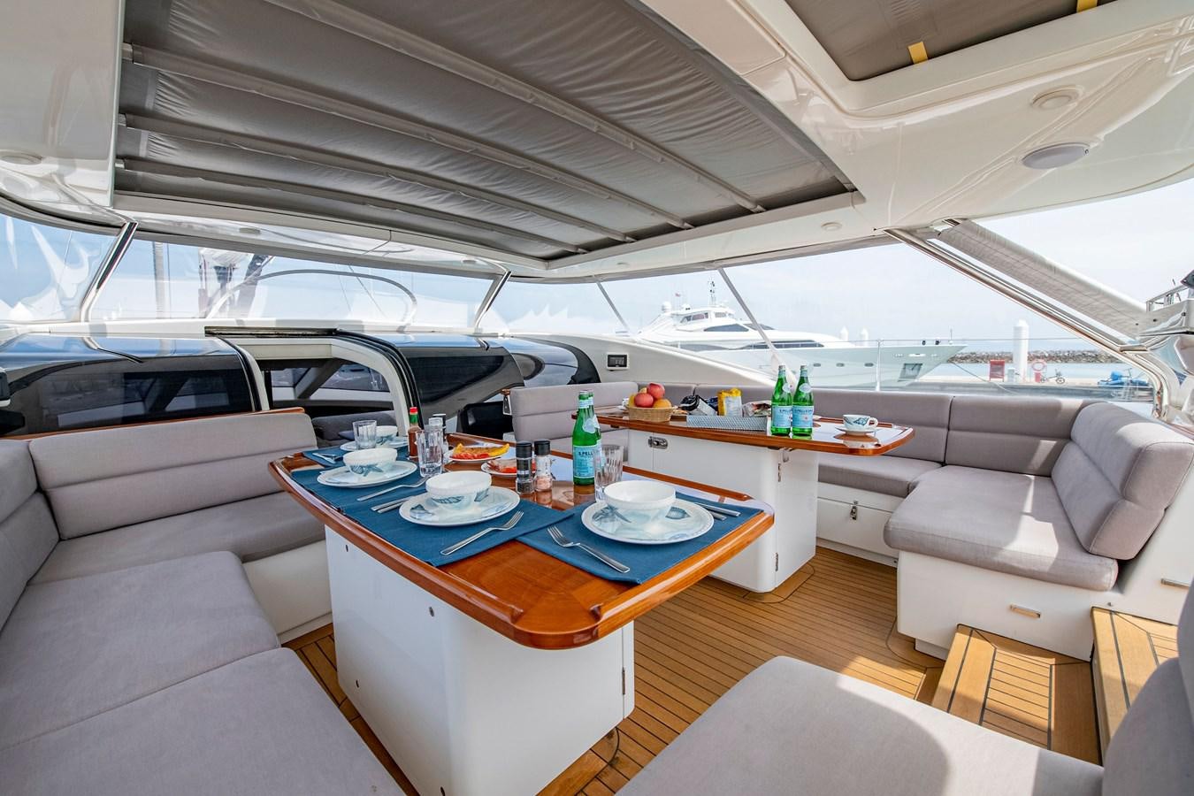 a boat with a table and chairs aboard SERAFIM Yacht for Sale