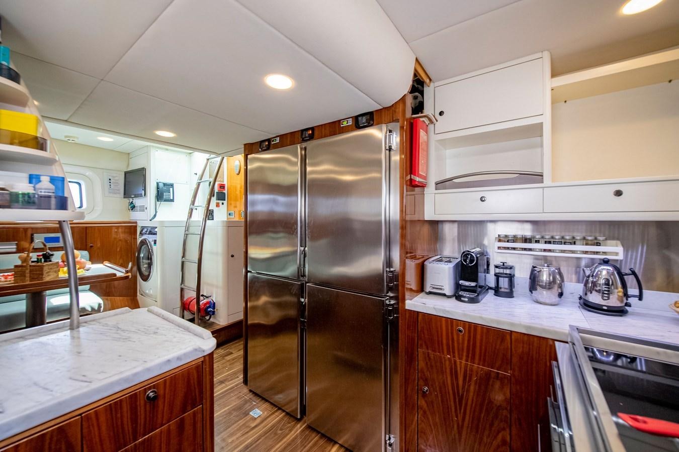 a kitchen with stainless steel appliances aboard SERAFIM Yacht for Sale
